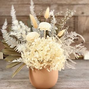 Dried flower arrangement, white colours, in a clay coloured pot